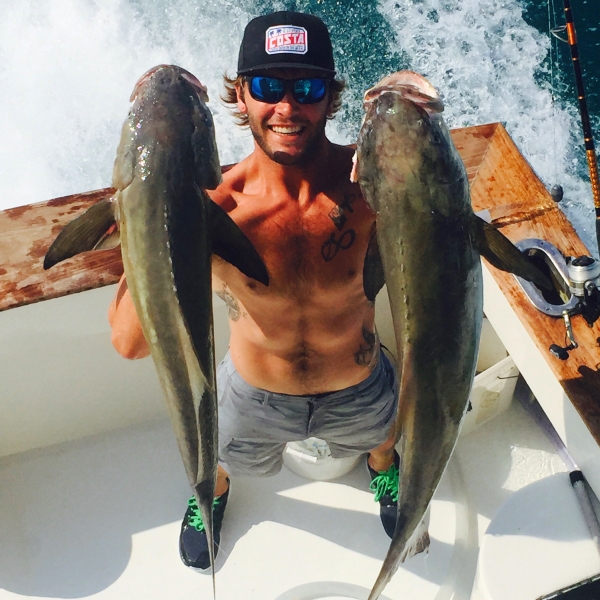 captain greg with two caught fish in florida